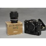 A Nikon FG SLR Camera, with Series-E f/3.5 36-72mm lens in maker's box