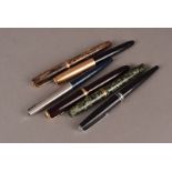 A group of five fountain pens, including a Parker Duofold, a Parker 51, two Parker 45s, a Conway