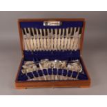 A sapele mahogany canteen of silver flatware by Viners Ltd, Sheffield 1961, to serve eight and