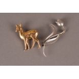 Two well designed brooches, one a yellow metal deer marked 750, approx. 5.2g, the other a tulip,