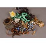 A small collection of Chinese hardstone beads, costume jewellery, and a pen partly made from the