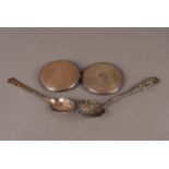 A collection of three silver compacts, plus a sugar sifter spoon, and silver teaspoon (5)
