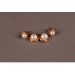 A pair of yellow metal and pearl earrings, probably 9ct, with white cultured pearl with circular