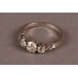 An Art Deco period three stone diamond engagement ring, set with three old cuts on mount with
