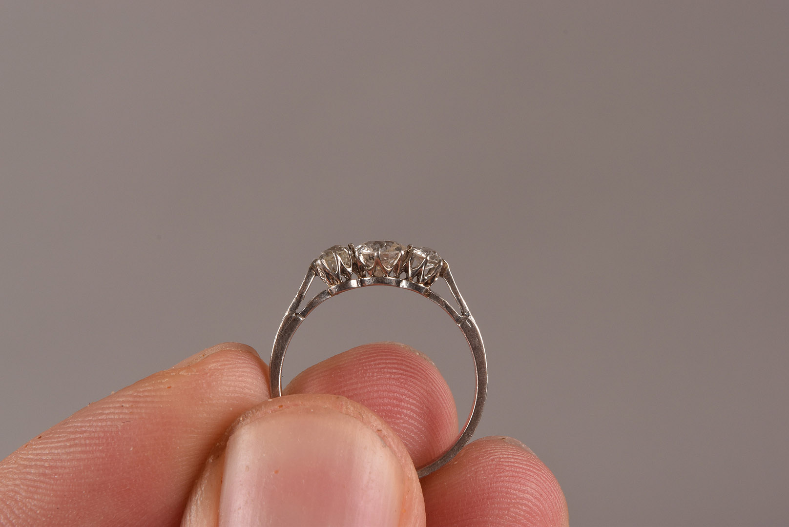 An Art Deco period three stone diamond engagement ring, set with three old cuts on mount with - Image 4 of 4