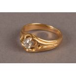An Edwardian period gold and diamond solitaire signet ring, the claw set old cut in probably 18ct