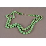 An Art Deco period Chinese hardstone bead necklace, having two strands of jade style beads on