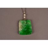 A fine Art Deco period Chinese hardstone pendant, the carved and pierced jade style panel with