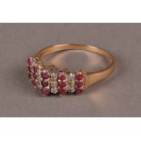 A modern 9ct gold and gem set dress ring, having nine columns of three ruby and diamonds, approx 2.