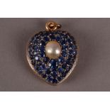 A fine Edwardian period gold sapphire and pearl locket pendant, heart shaped set with varying