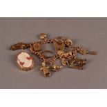A 9ct gold charm bracelet and cameo brooch, the vintage hallmarked curb link chain, possibly from