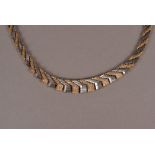 A retro 9ct gold necklace, the two tone chevron and textured link chain marked to clasp, approx 42.