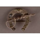 A vintage Scottish silver and hardstone brooch, modelled as a horse shoe set with agate panels and a