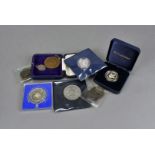 A collection of proof coinage, including the Alderney Coronation Anniversary £1, Turks and Caicos