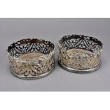 A pair of Martin Hall & Co 19th century silver plated wine bottle coasters, the circular pierced