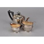 A Victorian silver batchelors three piece tea set, with lobed bottom section, Sheffield 1894 maker