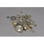 A collection of coins and jewellery, including two Victorian crowns, along with pennies, modern