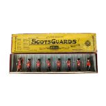 Britains boxed set 75 Scots Guards, 1935 version with piper in Whisstock box, VG in G box, lid