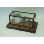 A 20th Century Negretti & Zambra Regency lacquered brass Barograph, with mahogany and bevelled glass