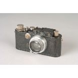 A Leica III Rangefinder Camera, black, serial no. 112904, with Leitz Summar f/2 50mm lens, chrome,