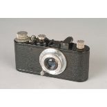 A Leica Standard Model E Camera, black, serial no. 200689, with Leitz Elmar f/3.5 50mm lens, chrome,