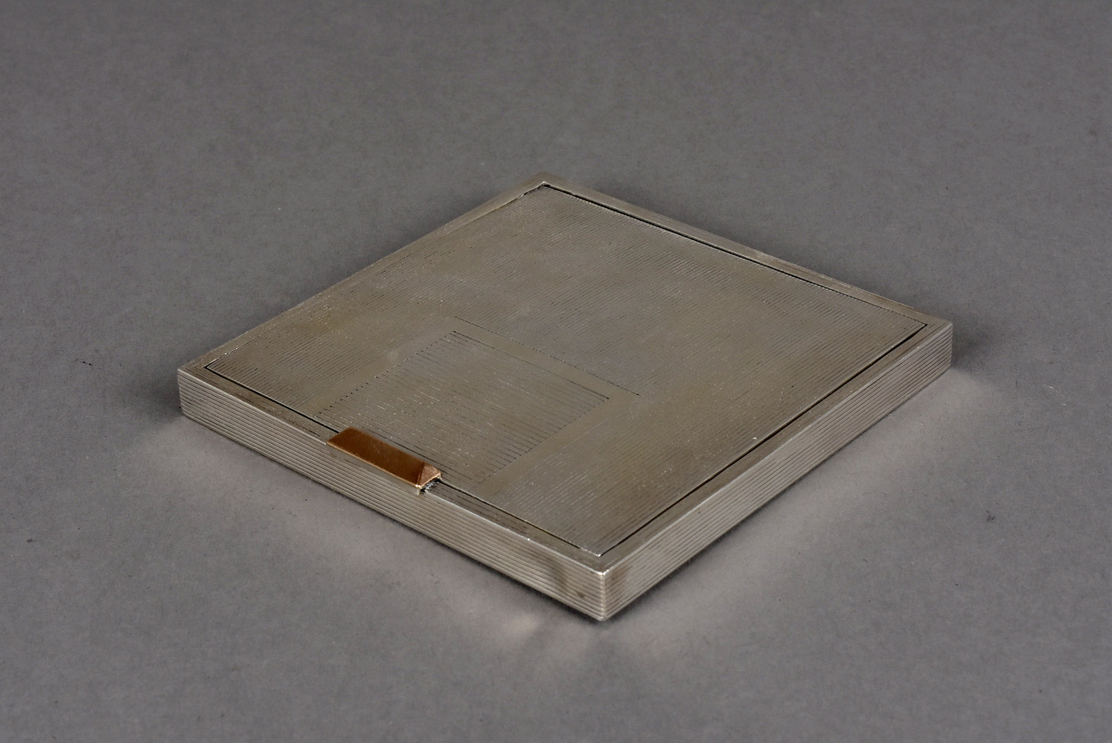 A fine George VI silver Art Deco style compact by D.S & S, the square form case with engraved