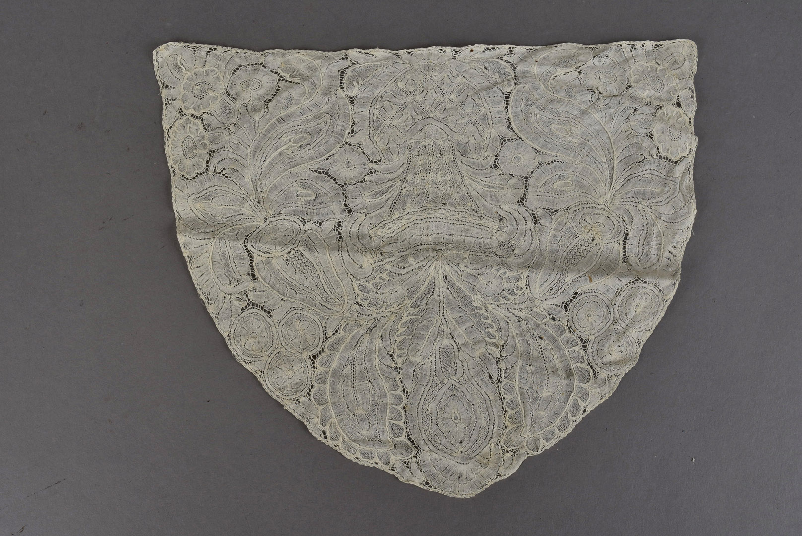 A Brussel’s lace capback, believed to be c.1735-45 21cm L