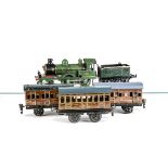 An Assembly of Modified Vintage GNR O Gauge Items, comprising a Carette 4-4-0 locomotive no 375,