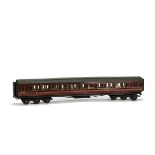 An O Gauge 12-wheel LMS 3rd-Class Corridor Coach by Milbro or similar, in LMS maroon as no 1089,