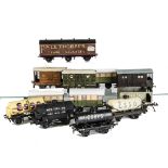 An Assortment of O Gauge Rolling Stock, including Bassett-Lowke NE brake van and GW van, a Bing