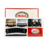 A Mamod O Gauge Live Steam RS1 Railway Set, with green 0-4-0T locomotive, two wagons and all