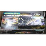 Scalextric, including a Super Speedway set and C extension pack, in original boxes F, boxes F (2)