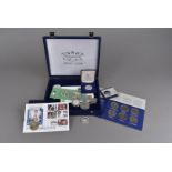 A collection of modern commemorative silver and other coins, including The Queen Mother's 80th