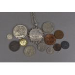 A selection of Victorian and later coinage, comprising an 1889 crown, mounted in a white metal