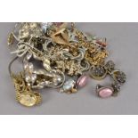 A small assortment of costume jewellery, comprising a yellow metal twist link chain, a lady's