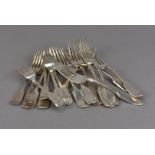 A collection of silver and silver plated flatware, comprising forks, knives, spoons and other