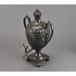 A Victorian silver plated Britannia metal tea urn, having engraved and embossed floral swag