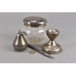 A vintage silver pen, marked London by JM & Co, together with a silver dwarf candlestick, a silver