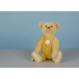 A Steiff Limited Edition yellow 1908 Teddy Bear, 516 of 3000, in original box with certificate,