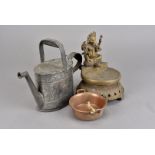 An interesting collection of copper and brass, including a figural brass Ganesh incense burner, a