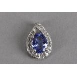 A 10k tanzanite and chip diamond pendant, of teardrop shape with crossover bale 1.5 g approx.