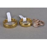 Two yellow metal bands, plus a lady's gold plated dress ring (3)