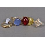 A 9 ct gold gem set ring, with chip diamond spacers, plus three other dress rings (4)