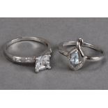 A silver blue topaz and chip diamond ring, size N½, plus a silver dress ring with princess cut cubic