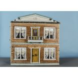 A rare Christian Hacker dolls’ house, of two storeys with papered brick exterior, central front