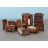 A dolls’ house bedroom set, probably German, of cherry red wood, comprising two single beds and