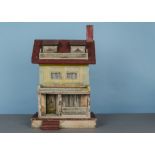 A Bliss dolls’ house, papered with red tiles, yellow, blue and pink façade, porch, two dormer