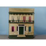 A Silber & Fleming type box-back dolls’ house, with stone painted façade, central green painted