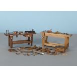 Two fine miniature wood working benches, one marked underneath LM, both with working vices, one of