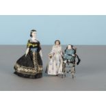Three early dolls’ house dolls, a Sonnenberg composition head girl with jointed wooden body and
